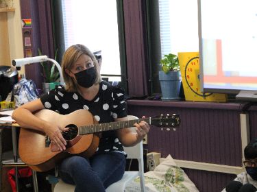  Teacher Playing Guitar